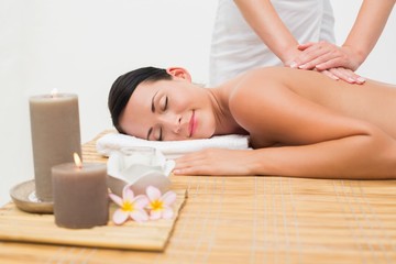 Fototapeta na wymiar Beautiful brunette enjoying a back massage