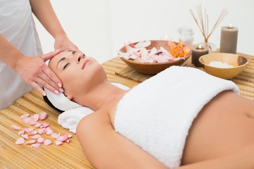 Obraz na płótnie Canvas Peaceful brunette enjoying a head massage