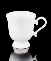 White cup of tea  isolated on black background