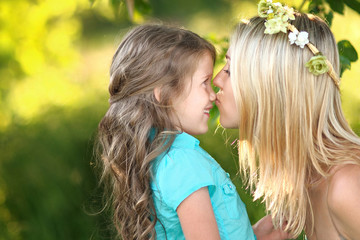 Fototapeta premium portrait of mother and daughter in nature