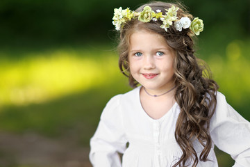 portrait of little girl outdoors in summer