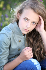 portrait of little girl outdoors in summer