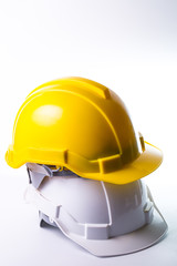 Fototapeta premium Safety hat isolated with alram clock