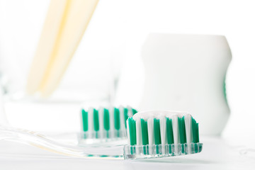 Toothbrush and floss with background