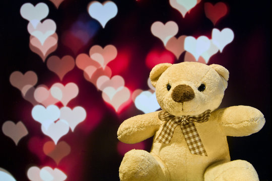 Lovely teddy bear with love bokeh