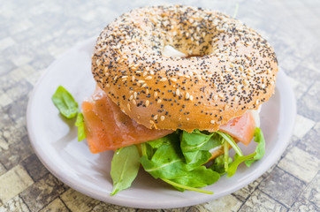 Bagel with fresh cheese and fresh lettuce