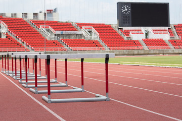 hurdles on the red running track prepared