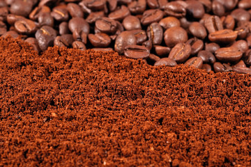 Heap of ground coffee and beans