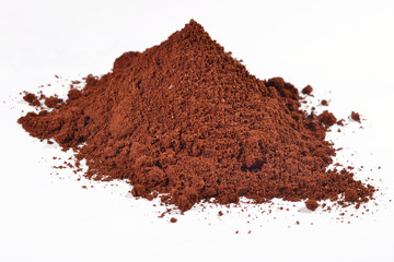 Heap of ground coffee on a white