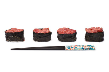 Four Gunkan Maki with Tuna and Chopsticks isolated on white