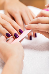 manicure making in beauty spa salon - obrazy, fototapety, plakaty