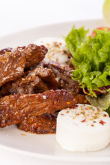 grilled beef stripes fresh salad and goat cheese