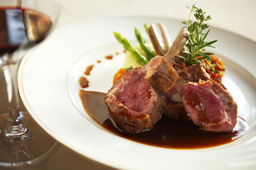 close up pork ribs steak and sauce in white dish