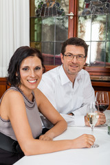 Waiter happily accommodating couple