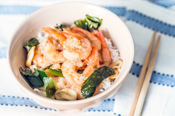 Bowls of asian fried shrimp and rice