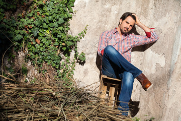 Male model sitting with legs crossed