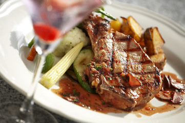 close up beef ribs steak and sauce in white dish