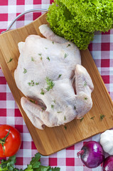 Raw chicken on table