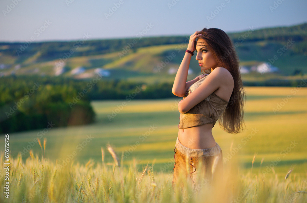 Wall mural girl in a wheat field