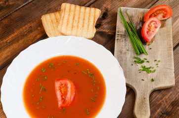 Tomato soup with toast and chive