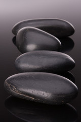 Spa stone arrangement on black surface