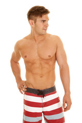 Fototapeta premium man red white stripe shorts look to side