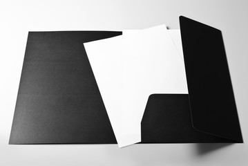 Folder and blank sheets of paper