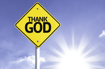 Thank God road sign with sun background