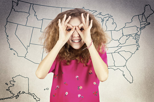 Curious happy girl looking through imaginary binoculars - Powered by Adobe