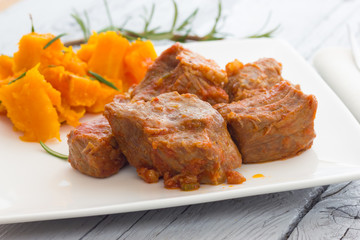 Pork stew garnished with pumpkin