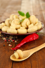 Mushrooms on plate, on wooden background