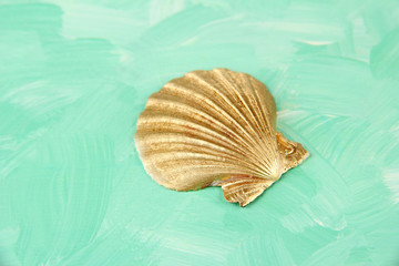 Colorful seashell on color wooden background