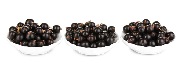 Fresh black currant isolated on white