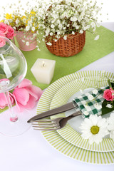 Table setting with spring flowers close up