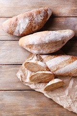 Fresh bread on wooden background
