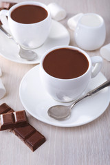 Cups of hot chocolate on table, close up