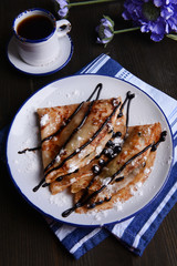 Delicious pancakes with blueberries on table close-up