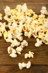 Obraz na płótnie Canvas Popcorn on wooden table, close up