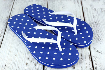 Color flip-flops on wooden background