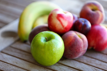 Juicy fruits on wooden table, close-up
