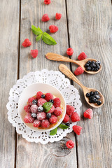 Sweet cakes with berries on table close-up