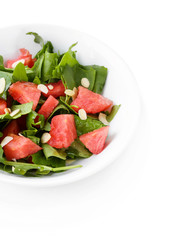 Salad with watermelon, onion, arugula and spinach leaves