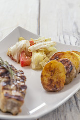 Fillet with fried Potatoes and salat