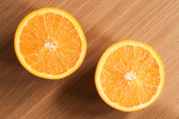 Fresh oranges on wooden table.
