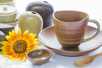 Mug and ceramic bowl on wooden table