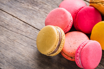 French colorful macarons on wood table