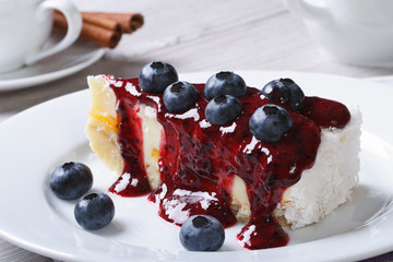 Cheesecake with blueberries and coffee on the table