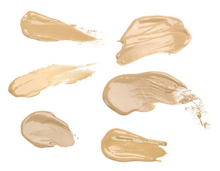 Collection of make up liquid foundation strokes on white