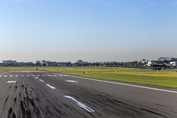 touchdown area with tire marks on a runway