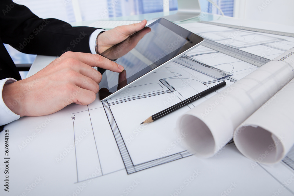 Poster Architect Using Digital Tablet On Blueprint In Office